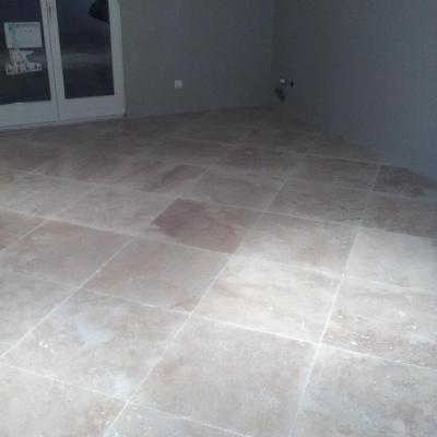 pose de carreaux pierre 50x50 chantier en suisse